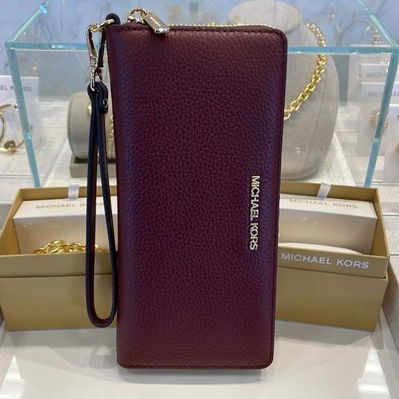 MICHAEL KORS
Leather Continental Wristlet Phone Case Wallet 
Oxblood 
NWT 
M - Picture 3 of 16